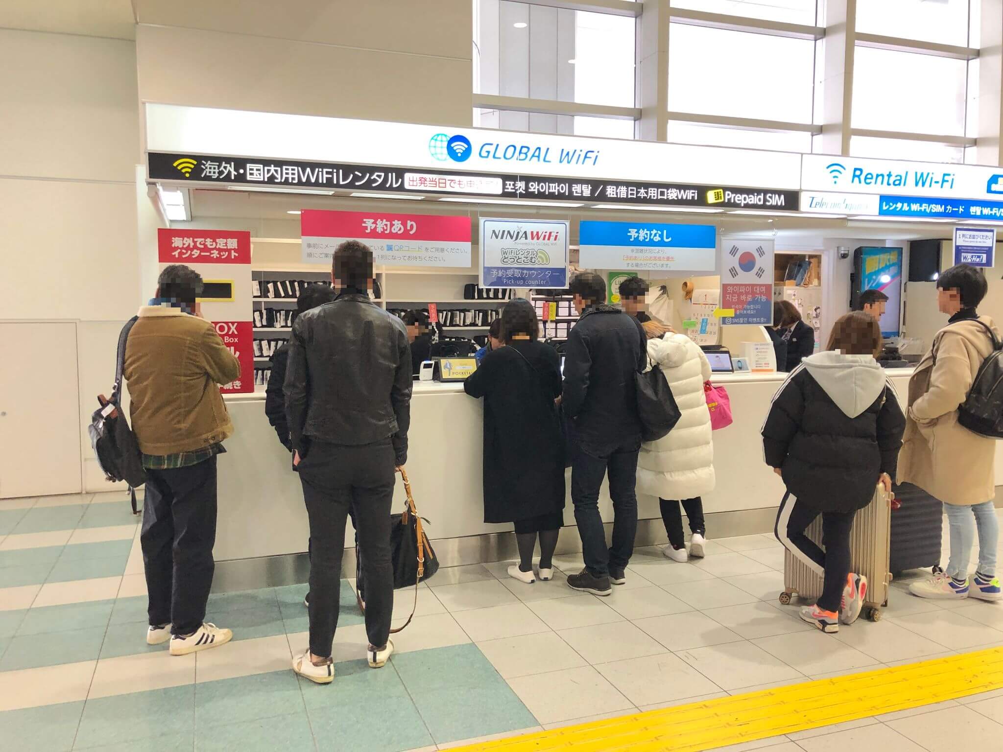 Long queue at the airport booth